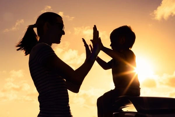 Image of happy mother and child after resolving child arrangements Powys